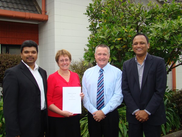 Mr Arjun Sami (RSSL Investments), Franklin District Council CEO Sally Davis, Franklin District Council Mayor Mark Ball and RSSL Investments Project Manager Abinesh Krishan with the Memorandum of Understanding agreement for Tuakau East. 